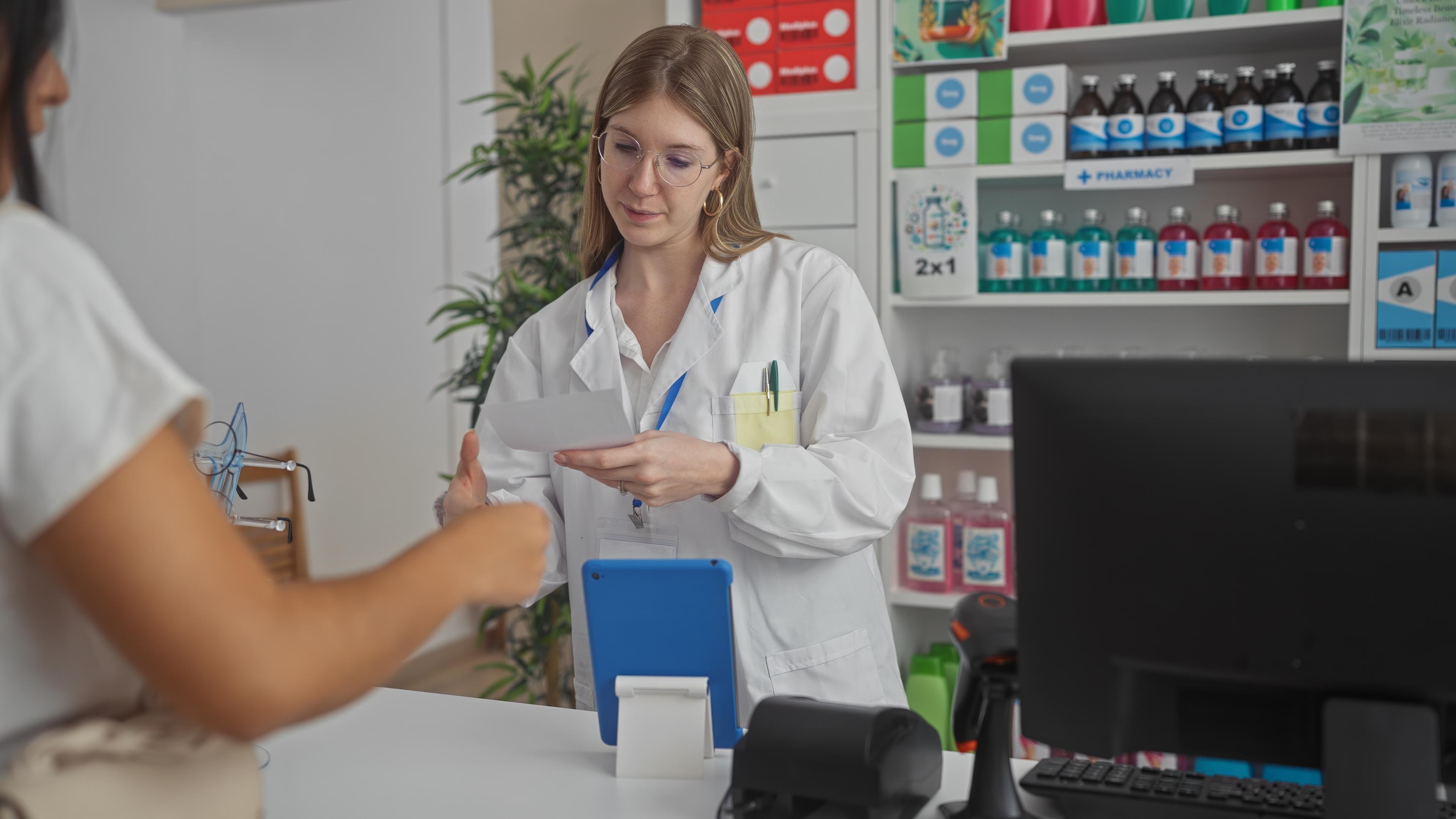 Pharmacist consulting with a patient in a pharmacy setting